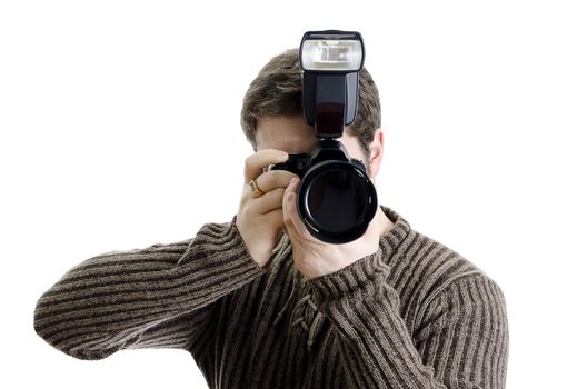 Photojournalist holding camera with flash. Isolated on white.