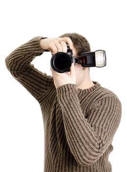 Photojournalist holding camera with flash. Isolated on white.