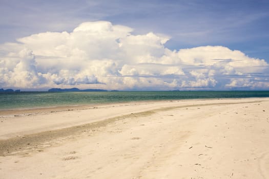 sunny beach, blue ocean and clean sky