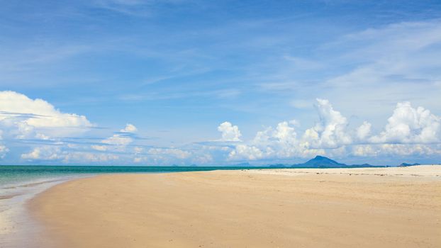 sunny beach, blue ocean and clean sky