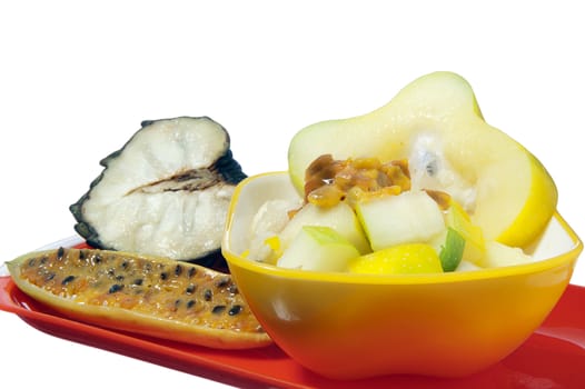salad with tropical fruits on white background