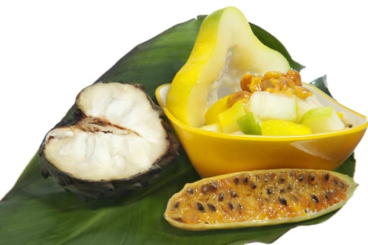 salad with tropical fruits on white background