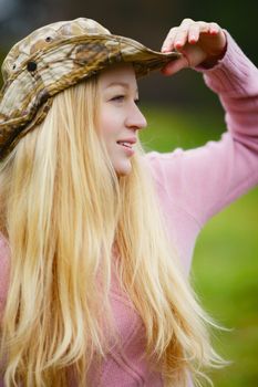 beautiful girl with long blond hair looking