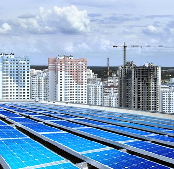 solarpanel on roof of building that is new microdistrict