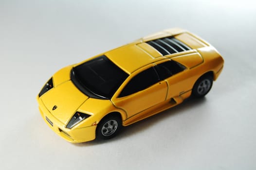 Scale model replica of lamborghini murciélago on white background