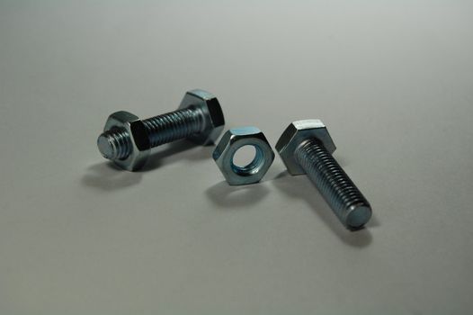 A set of shiny metal nuts and bolts for do-it-yourself  stuff or repairing/replacing old parts