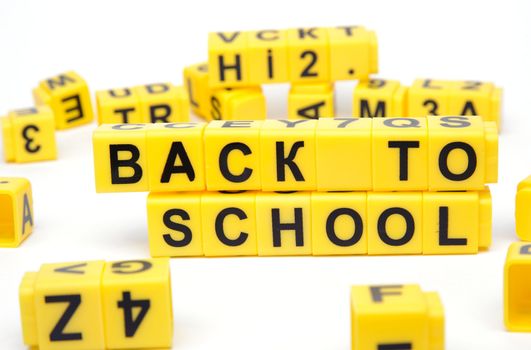 An image of yellow bricks with words ''back to school'' on them