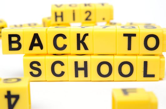 An image of yellow bricks with words ''back to school'' on them