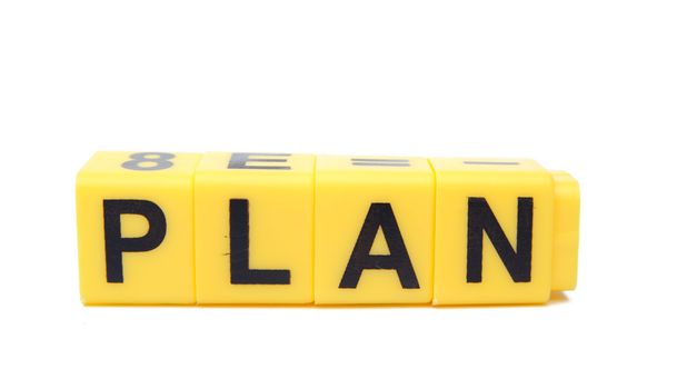 An image of yellow blocks with word ''plan'' on them