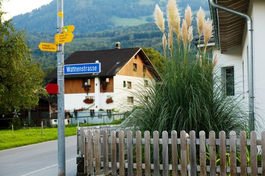 An image of a little house and a sign