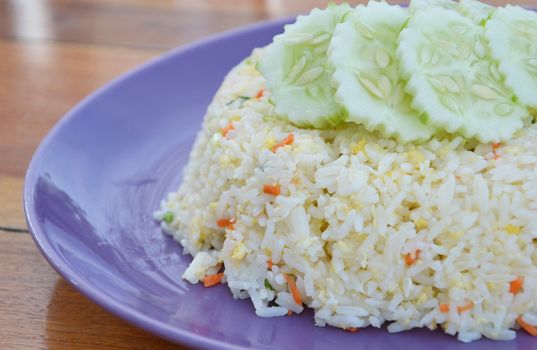 close-up fried rice with pork , served with cucumber