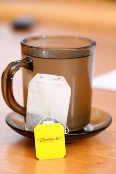 An image of cup of tea on table in a kitchen