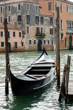 Traveling theme. Gondola on canal in Venice.