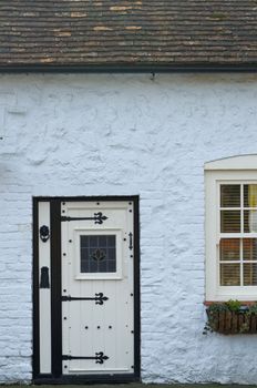 White front door with black fittings