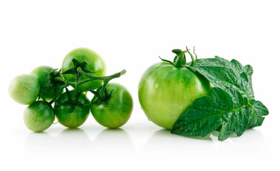 Ripe Wet Green Tomatoes with Leaves Isolated on White Background  