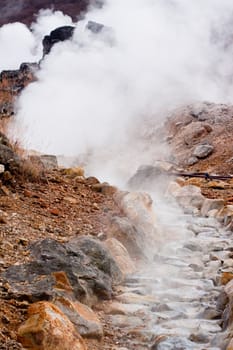 A valley of geysers in japanese mouintains
