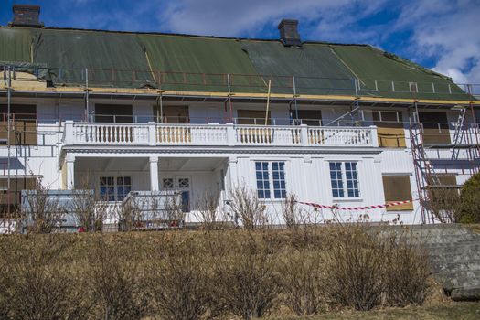 There is ongoing a major maintenance work on the Red Mansion in Halden, Norway, among other things, it added a new roof. The photo was shot one day in April 2013.