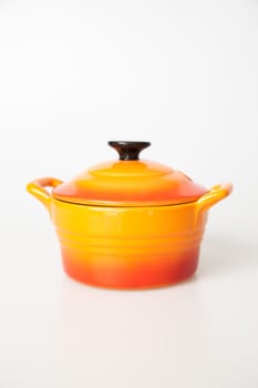 Orange cooking pot with lid
