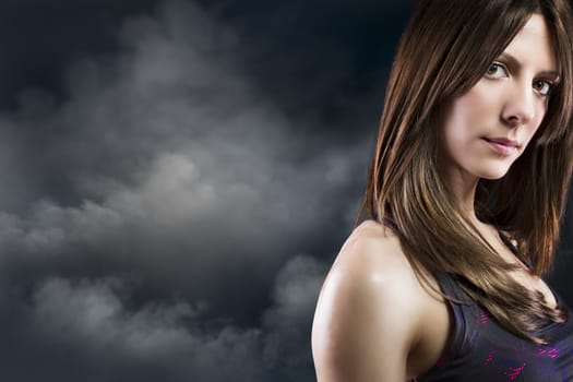 beautiful woman athlete on Cloud Background, fitness