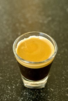 A shot of espresso on classy shot glass