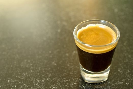 A shot of espresso on classy shot glass
