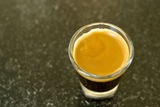 A shot of espresso on classy shot glass