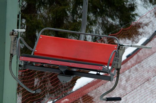 Detail of old ski lift chair on a bright winter day