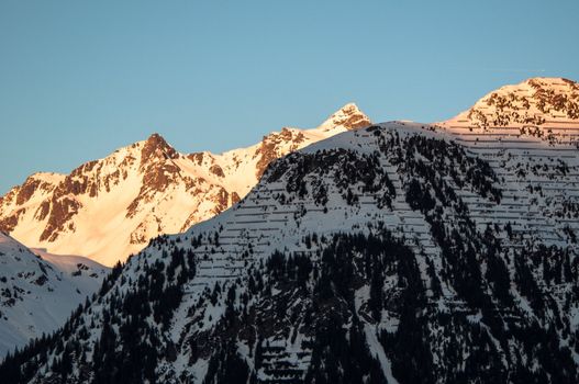 sunset in winter mountains landscape in Montafon, Austria