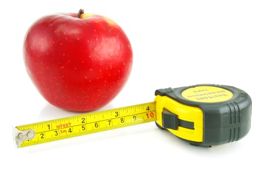 Bright red apple and measuring tape isolated on a white background