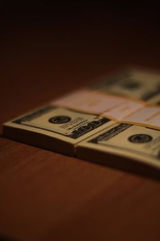 Stacks of hundred dollar bills close up.