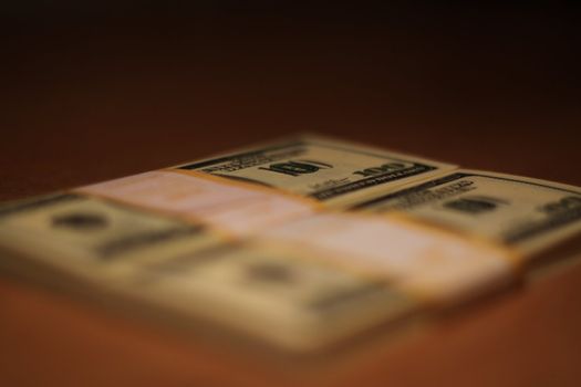 Stacks of hundred dollar bills close up.