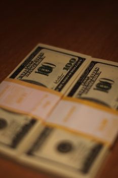 Stacks of hundred dollar bills close up.