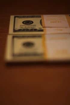 Stacks of hundred dollar bills close up.