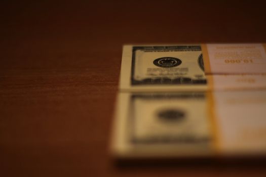 Stacks of hundred dollar bills close up.