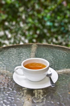 cup of tea on glass table