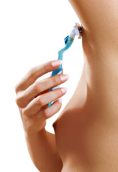 shaves a part of female armpit with the razor