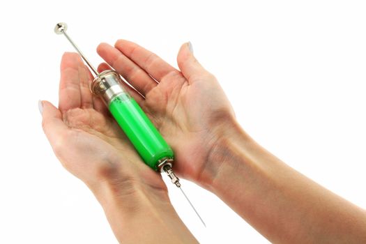 Reusable syringe with acid substance in hands isolated on a white background