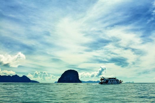 seascape with boat and rocks, Andaman Sea, Thailand