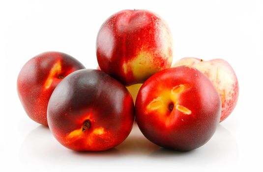 Group of Ripe Peach (Nectarine) with Green Leafs Isolated on White Background