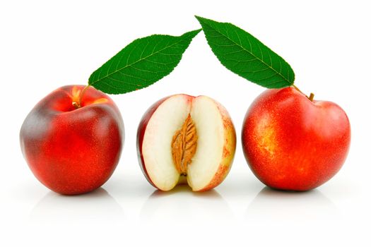 Ripe Sliced Peach (Nectarine) with Green Leafs Isolated on White Background