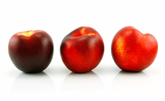 Three Ripe Peaches (Nectarine) Isolated on White Background