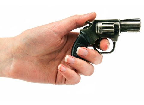 Small revolver gun in female hand isolated on a white background