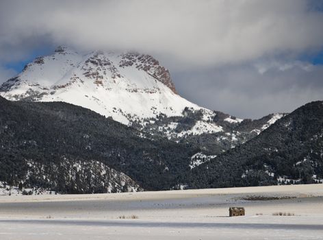 Sphinx Mountain and ranch land in winter, Madison County, Montana, USA