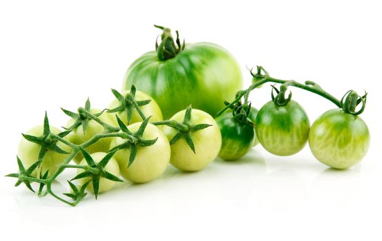 Bunch of Ripe Yellow and Green Tomatoes with Green Leaf Isolated on White Background