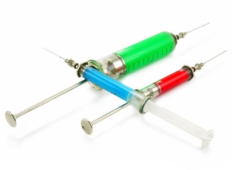 Three reusable syringes with acid substance isolated on a white background