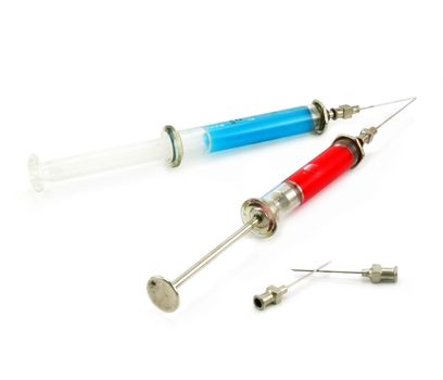 Two syringes with acid substance isolated on a white background