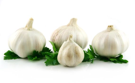 Garlic Vegetable with Green Parsley Leaves Isolated on White Background