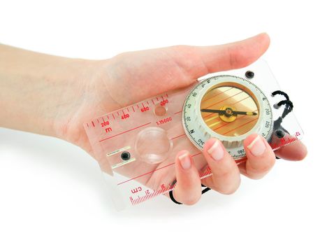 Female hand holds transparent liquid compass isolated