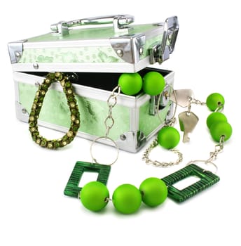 Light green trunk, beeads and armlet isolated on a white background