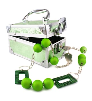 Light green trunk, beads and armlet isolated on a white background